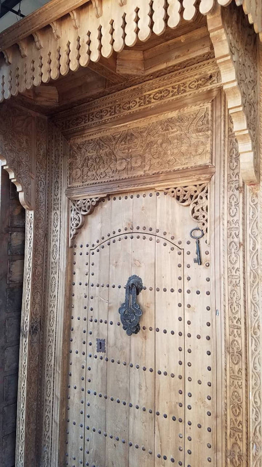 Custom Massive, heavy-set Andalusian-style doors where the natural wood grain is the star