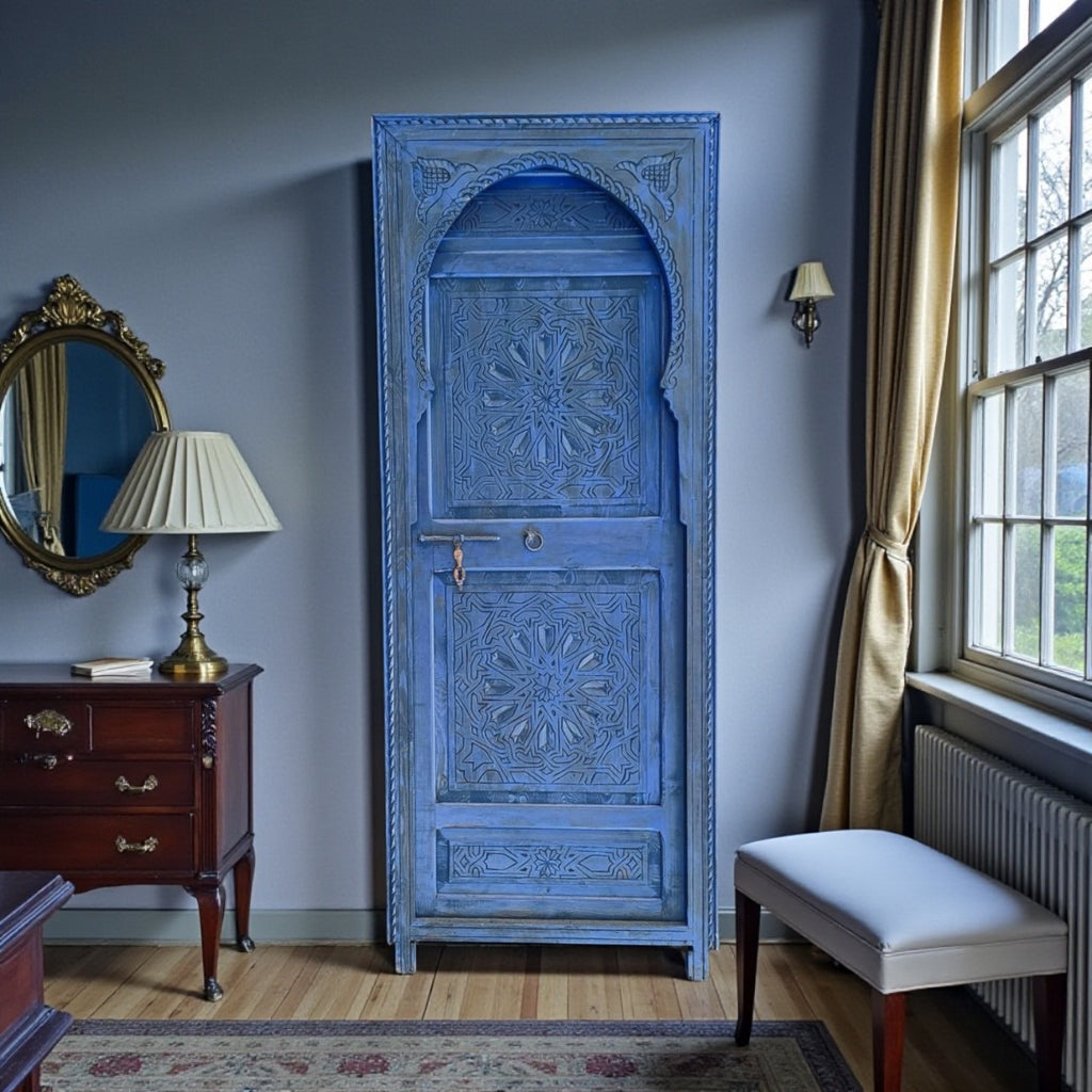 Blue Moroccan-style door with intricate patterns, showcasing Tangier-inspired design and vibrant color details.