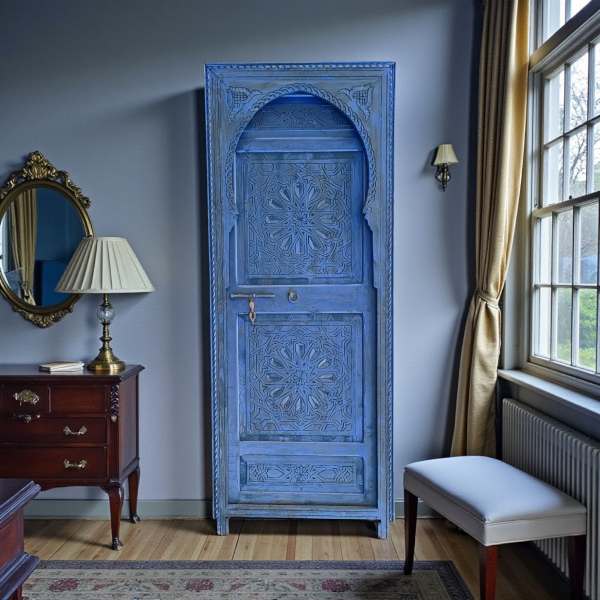 Blue Moroccan-style door with intricate patterns, showcasing Tangier-inspired design and vibrant color details.