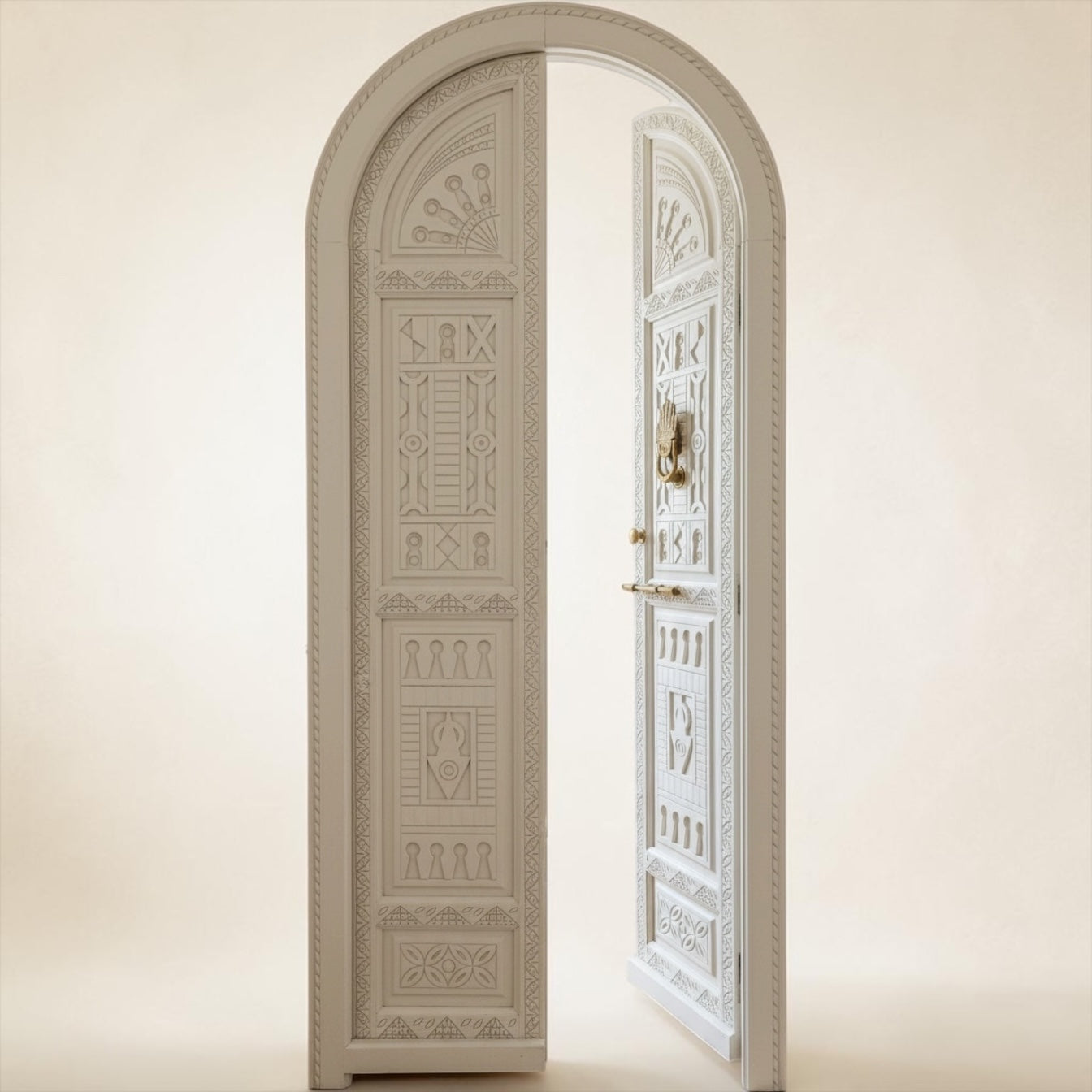 Decorative arched door with intricate carvings on a beige background