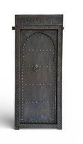 Decorative metal Moroccan door with intricate designs on a white background